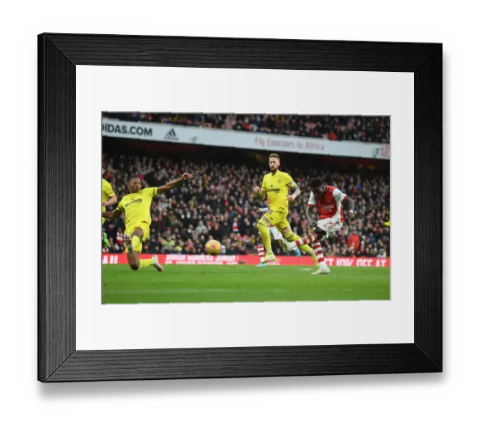 Framed Print : Bukayo Saka Scores His Second Goal: Arsenal's Victory Over Brentford in the 2021-22 Premier League Framed Print : Bukayo Saka Scores His Second Goal: Arsenal's Victory Over Brentford in the 2021-22 Premier League