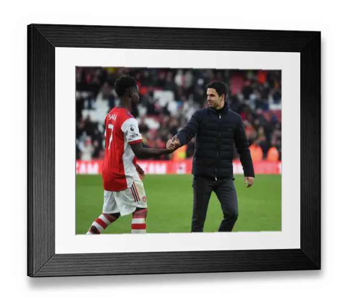 Framed Print : Arsenal's Mikel Arteta and Bukayo Saka Celebrate Victory Over Brentford Framed Print : Arsenal's Mikel Arteta and Bukayo Saka Celebrate Victory Over Brentford