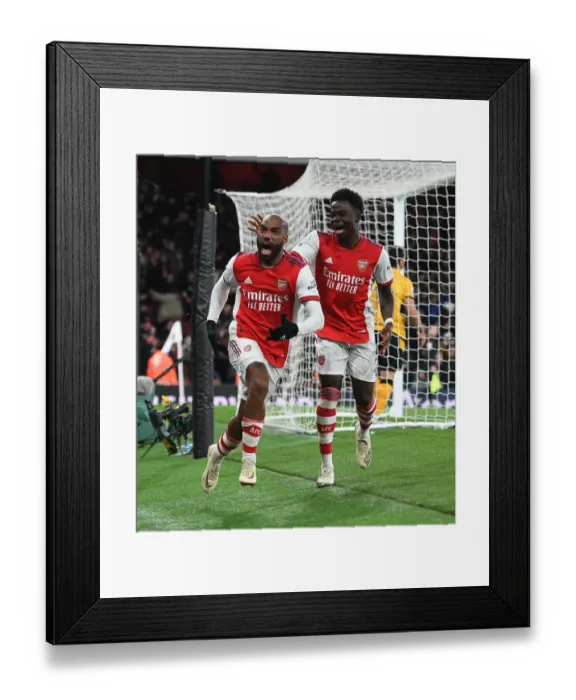 Framed Print : Arsenal's Lacazette and Saka Celebrate Goals Against Wolverhampton Wanderers in Premier League Match Framed Print : Arsenal's Lacazette and Saka Celebrate Goals Against Wolverhampton Wanderers in Premier League Match