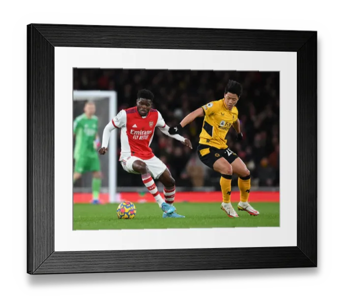 Framed Print : Thomas Partey's Powerful Surge: Arsenal Overpowers Wolverhampton Wanderers