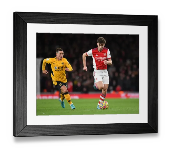 Framed Print : Arsenal's Kieran Tierney Outwits Daniel Podence: Premier League Victory at Emirates Stadium Framed Print : Arsenal's Kieran Tierney Outwits Daniel Podence: Premier League Victory at Emirates Stadium