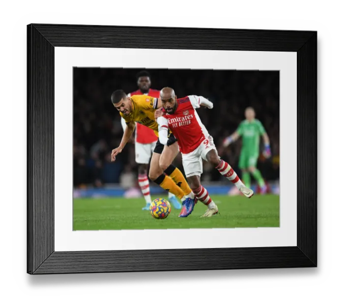 Framed Print : Arsenal's Lacazette Clashes with Coady in Intense Premier League Showdown at Emirates Stadium