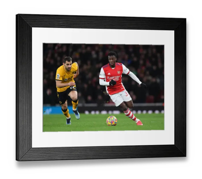 Framed Print : Arsenal's Eddie Nketiah Outmaneuvers Wolverhampton's Jonny in Premier League Clash