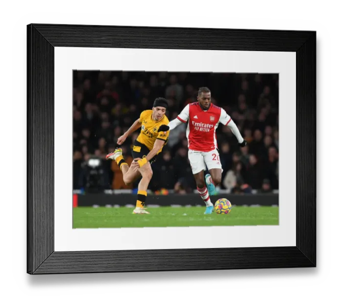 Framed Print : Arsenal's Nuno Tavares Outsmarts Raul Jimenez: A Premier League Battle at Emirates Stadium Framed Print : Arsenal's Nuno Tavares Outsmarts Raul Jimenez: A Premier League Battle at Emirates Stadium