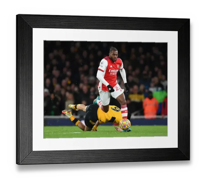 Framed Print : Nuno Tavares Slick Move: Outsmarting Raul Jimenez in Arsenal's Victory over Wolverhampton Wanderers Framed Print : Nuno Tavares Slick Move: Outsmarting Raul Jimenez in Arsenal's Victory over Wolverhampton Wanderers