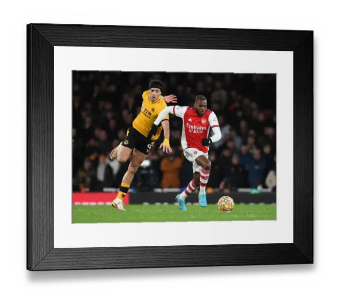 Framed Print : Nuno Tavares Outsmarts Raul Jimenez: A Stunning Moment of Skill from Arsenal's Defender in the Arsenal vs. Wolverhampton Wanderers Match Framed Print : Nuno Tavares Outsmarts Raul Jimenez: A Stunning Moment of Skill from Arsenal's Defender in the Arsenal vs. Wolverhampton Wanderers Match