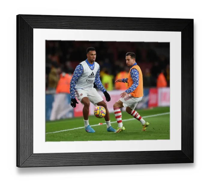 Framed Print : Arsenal Players Gabriel Magalhaes and Cedric Soares Warm Up Ahead of Arsenal v Wolverhampton Wanderers, Premier League 2021-22
