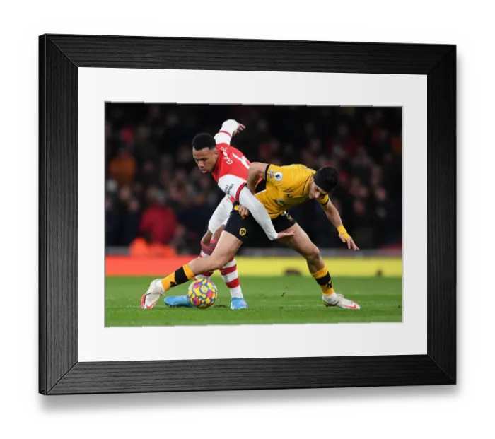 Framed Print : Magalhaes vs. Jimenez: A Premier League Showdown at Emirates Stadium Framed Print : Magalhaes vs. Jimenez: A Premier League Showdown at Emirates Stadium