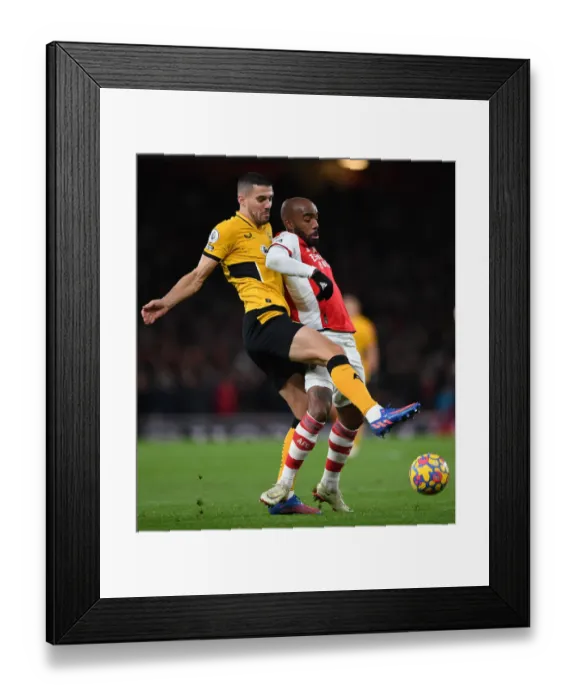 Framed Print : Intense Battle: Lacazette vs. Coady - Arsenal vs. Wolverhampton Wanderers Premier League Clash Framed Print : Intense Battle: Lacazette vs. Coady - Arsenal vs. Wolverhampton Wanderers Premier League Clash