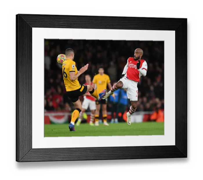 Framed Print : Lacazette vs. Coady: A Premier League Showdown at the Emirates Framed Print : Lacazette vs. Coady: A Premier League Showdown at the Emirates
