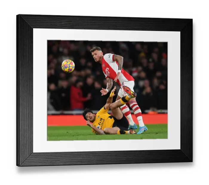 Framed Print : Intense Rivalry: Ben White vs. Raul Jimenez - Arsenal vs. Wolverhampton Wanderers Premier League Showdown Framed Print : Intense Rivalry: Ben White vs. Raul Jimenez - Arsenal vs. Wolverhampton Wanderers Premier League Showdown