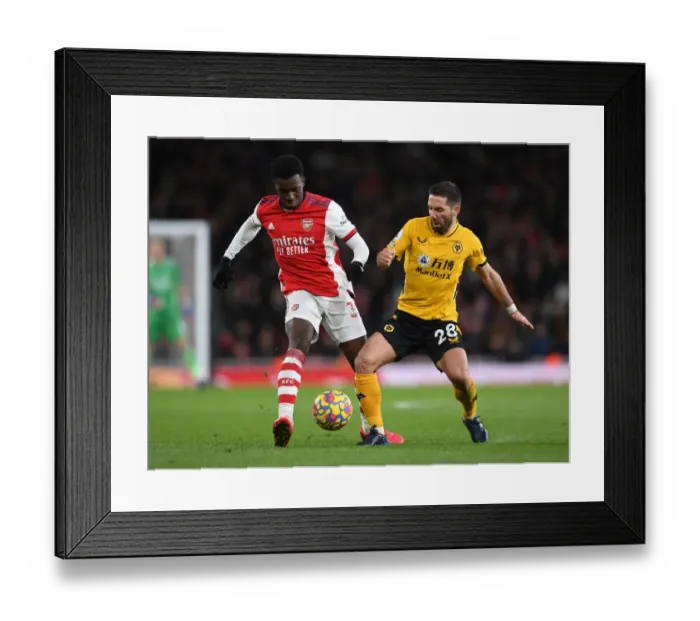 Framed Print : Intense Battle: Arsenal vs. Wolverhampton Wanderers at Emirates Stadium