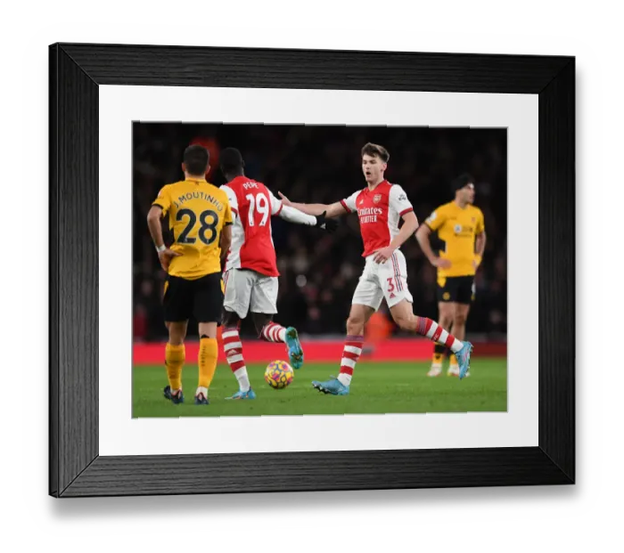Framed Print : Pepe and Tierney Celebrate Arsenal's First Goal Against Wolverhampton Wanderers (2021-22)