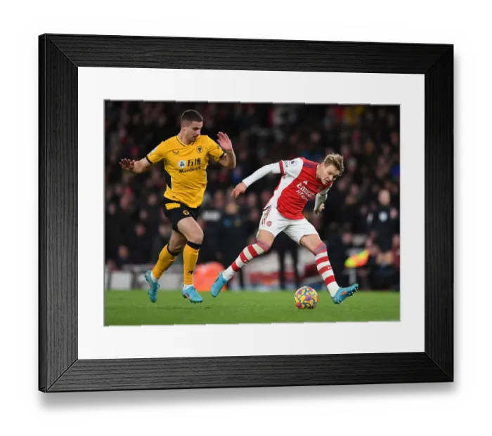 Framed Print : Martin Odegaard vs. Leander Dendoncker: Intense Rivalry in Arsenal vs. Wolverhampton Wanderers Premier League Clash Framed Print : Martin Odegaard vs. Leander Dendoncker: Intense Rivalry in Arsenal vs. Wolverhampton Wanderers Premier League Clash