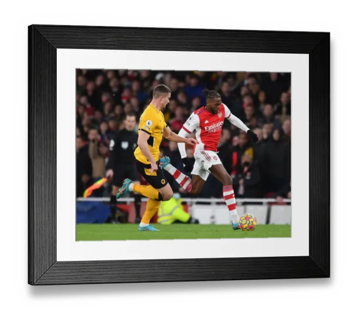 Framed Print : Arsenal's Nuno Tavares Clashes with Leander Dendoncker of Wolverhampton Wanderers: A Premier League Showdown