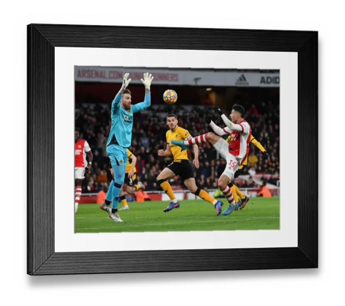 Framed Print : Arsenal's Martinelli Tries to Outwit Wolves Sa in Premier League Clash