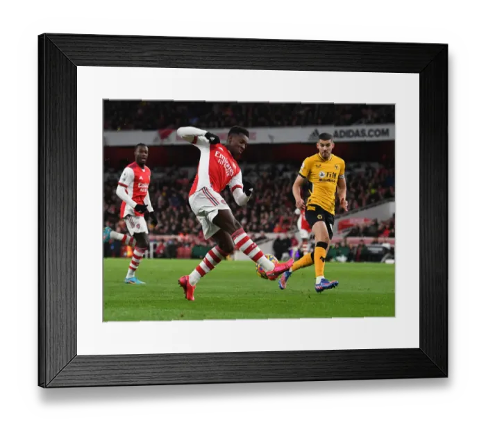Framed Print : Nketiah vs. Coady: A Battle of Wits in the Arsenal vs. Wolverhampton Wanderers Premier League Clash