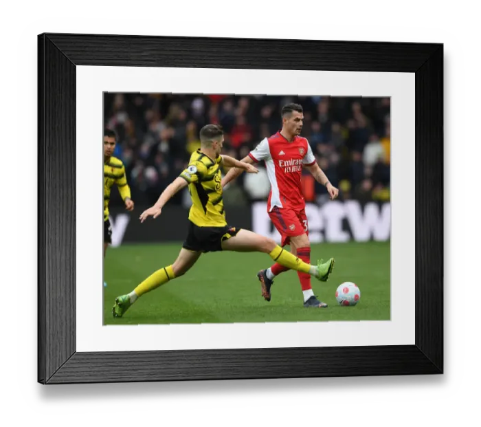 Framed Print : Granit Xhaka vs Craig Cathcart: Intense Battle in Watford v Arsenal Premier League Clash Framed Print : Granit Xhaka vs Craig Cathcart: Intense Battle in Watford v Arsenal Premier League Clash
