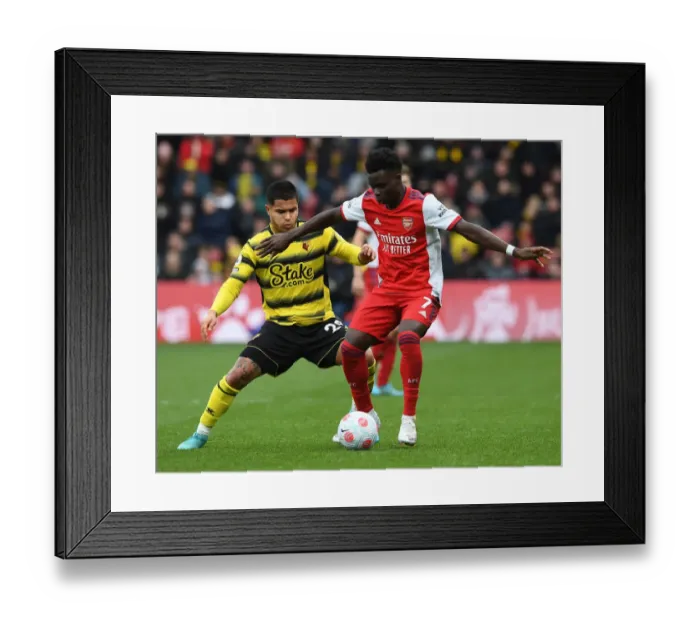 Framed Print : Bukayo Saka Faces Off Against Cucho Hernandez: Watford vs Arsenal, Premier League 2021-22