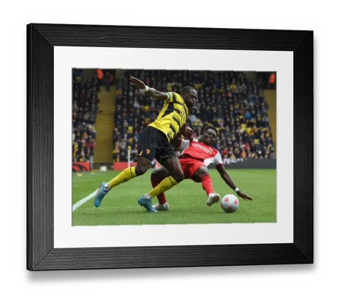 Framed Print : Bukayo Saka vs. Moussa Sissoko: Intense Clash in Watford v Arsenal Premier League Match