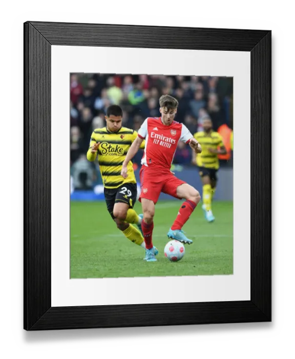 Framed Print : Arsenal's Kieran Tierney Outmaneuvers Watford's Cucho Hernandez in Premier League Clash Framed Print : Arsenal's Kieran Tierney Outmaneuvers Watford's Cucho Hernandez in Premier League Clash