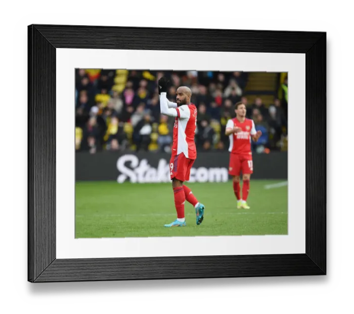 Framed Print : Alexis Lacazette Celebrates with Arsenal Fans: Arsenal's Triumph at Watford, Premier League 2021-22