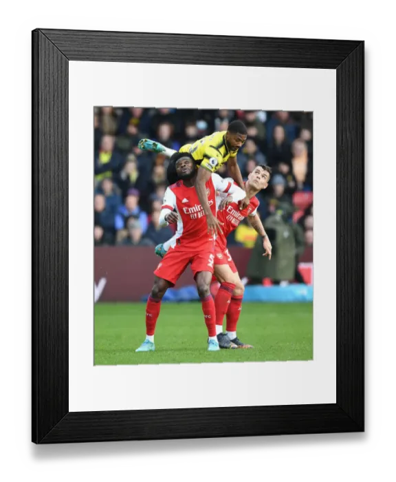 Framed Print : Thomas Partey and Granit Xhaka Clash with Emmanuel Dennis in Intense Watford vs. Arsenal Premier League Encounter