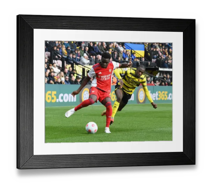 Framed Print : Bukayo Saka Faces Off Against Hassane Kamara: Watford vs Arsenal, Premier League 2021-22