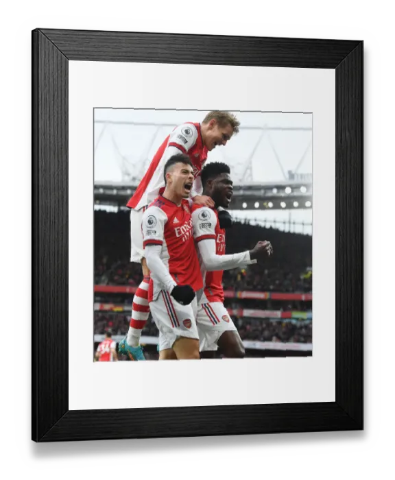 Framed Print : Arsenal's Triumph: Partey, Martinelli, and Odegaard Celebrate Goal Against Leicester City