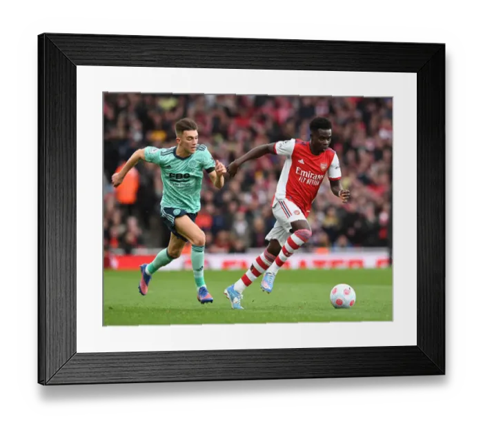 Framed Print : Arsenal's Bukayo Saka Clashes with Leicester's Luke Thomas in Premier League Showdown Framed Print : Arsenal's Bukayo Saka Clashes with Leicester's Luke Thomas in Premier League Showdown
