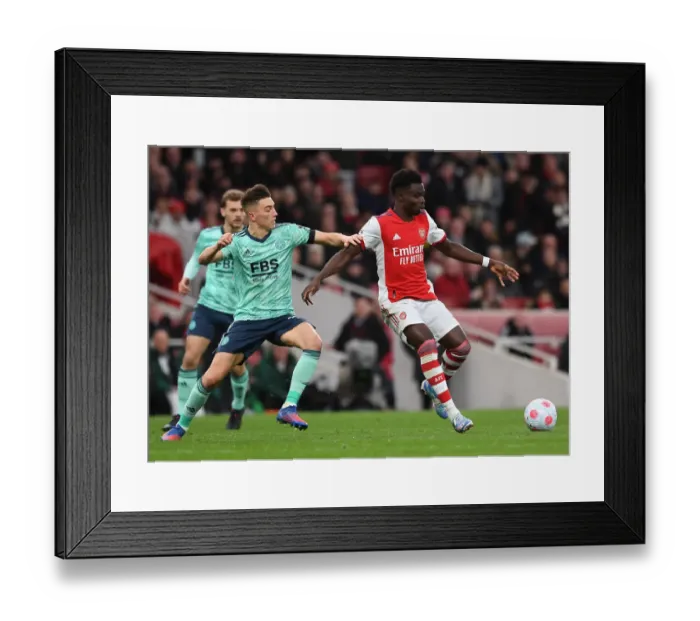 Framed Print : Arsenal's Rising Talents: Saka vs Thomas - A Premier League Battle at Emirates Stadium