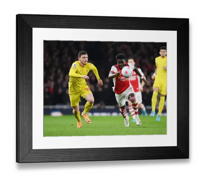 Framed Print : Clash of the Stars: Saka vs. Robertson - Arsenal vs. Liverpool at Emirates Stadium