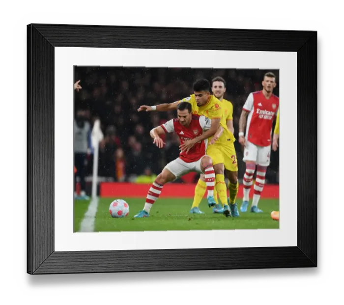 Framed Print : Arsenal vs Liverpool: Cedric Holds Off Luis Diaz in Intense Premier League Clash Framed Print : Arsenal vs Liverpool: Cedric Holds Off Luis Diaz in Intense Premier League Clash
