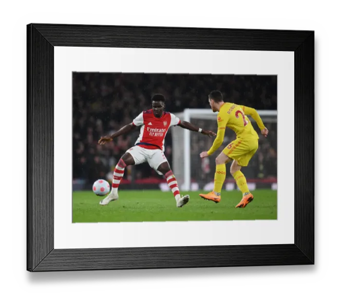Framed Print : Saka vs. Robertson: A Premier League Showdown at Emirates - Arsenal vs. Liverpool