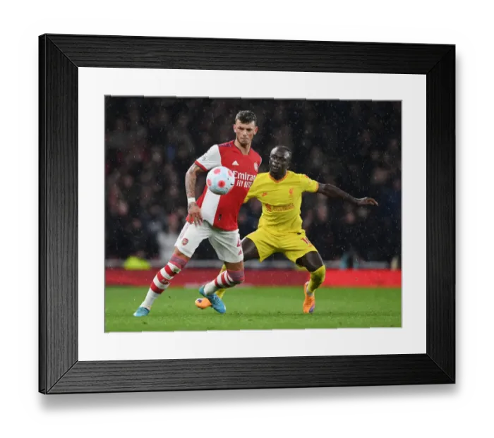 Framed Print : Arsenal vs. Liverpool: White Holds Off Mane in Intense Premier League Clash