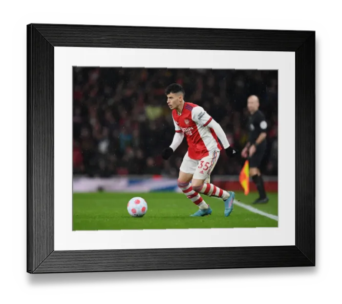 Framed Print : Martinelli vs Liverpool: Arsenal's Rising Star Clashes in Premier League Battle
