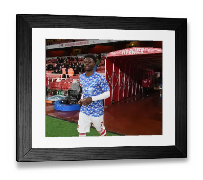 Framed Print : Arsenal's Bukayo Saka: Focused and Ready for Arsenal vs. Liverpool Showdown in Premier League