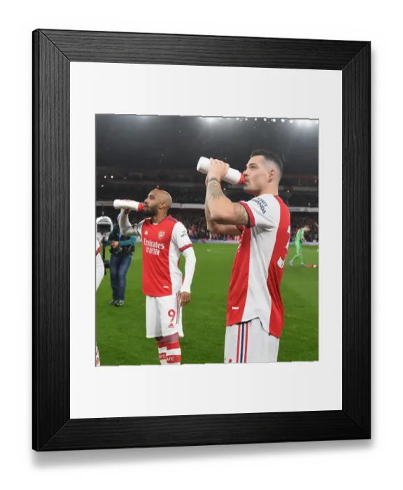 Framed Print : Arsenal's Lacazette and Xhaka Prepare for Arsenal v Liverpool Clash (2021-22) Framed Print : Arsenal's Lacazette and Xhaka Prepare for Arsenal v Liverpool Clash (2021-22)