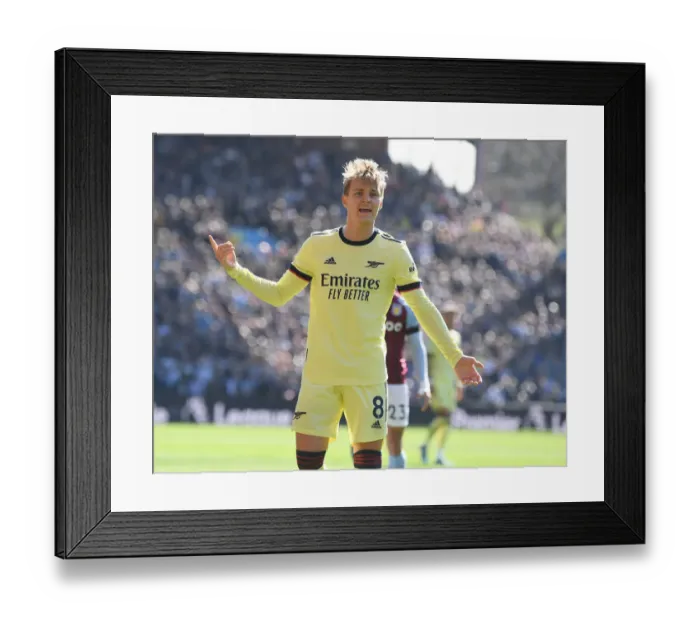 Framed Print : Martin Odegaard in Action: Arsenal's Midfield Maestro Shines Against Aston Villa in the Premier League 2021-22 Framed Print : Martin Odegaard in Action: Arsenal's Midfield Maestro Shines Against Aston Villa in the Premier League 2021-22
