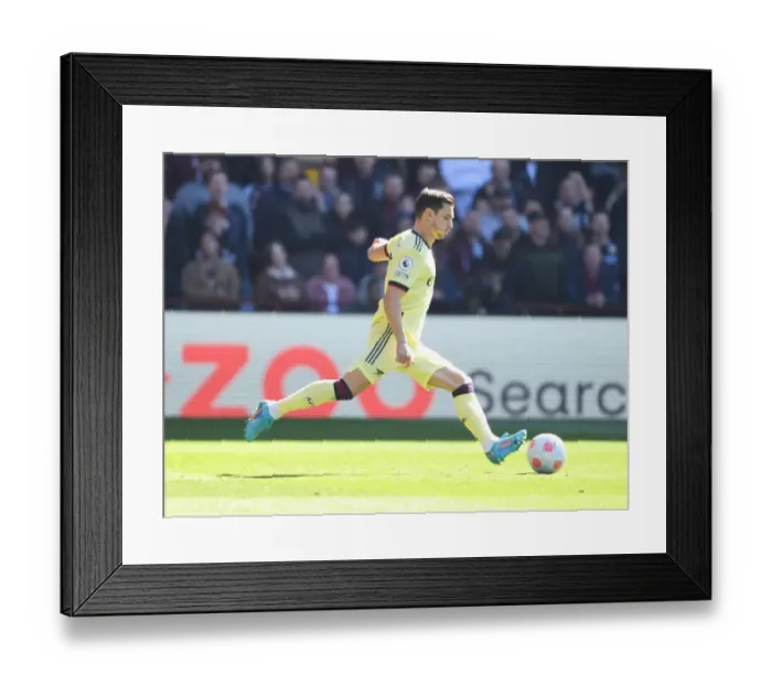 Framed Print : Arsenal's Cedric Faces Off Against Aston Villa in Premier League Clash