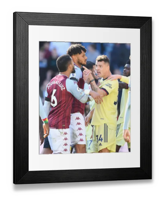 Framed Print : Clash of Midfielders: Xhaka vs. Douglas Luiz in Aston Villa vs. Arsenal Premier League Match Framed Print : Clash of Midfielders: Xhaka vs. Douglas Luiz in Aston Villa vs. Arsenal Premier League Match