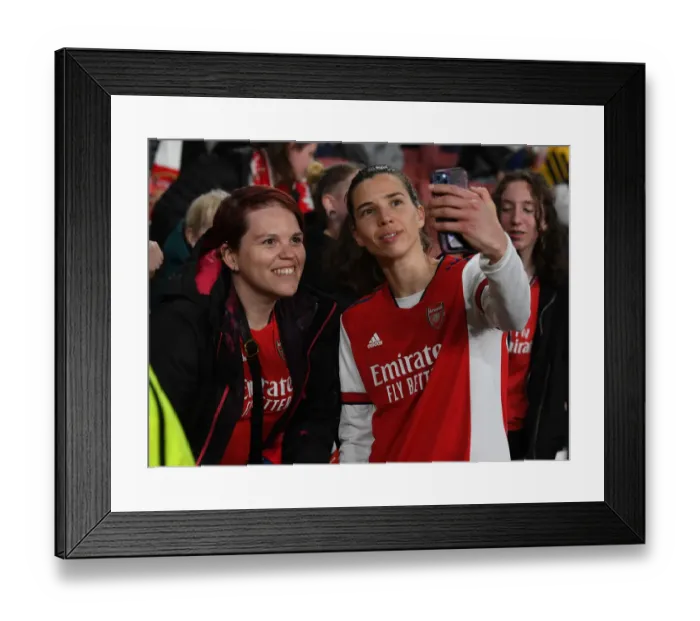 Framed Print : Arsenal Women's Champions League Triumph: Tobin Heath and Ecstatic Fans Celebrate First Leg Victory over VfL Wolfsburg Framed Print : Arsenal Women's Champions League Triumph: Tobin Heath and Ecstatic Fans Celebrate First Leg Victory over VfL Wolfsburg