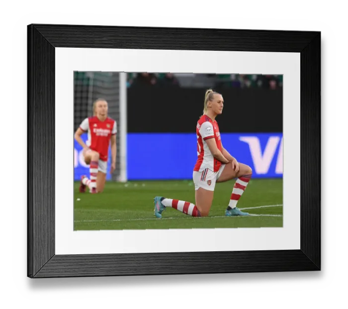 Framed Print : Arsenal's Stina Blackstenius Takes a Knee in UEFA Women's Champions League Quarterfinal Second Leg against VfL Wolfsburg Framed Print : Arsenal's Stina Blackstenius Takes a Knee in UEFA Women's Champions League Quarterfinal Second Leg against VfL Wolfsburg