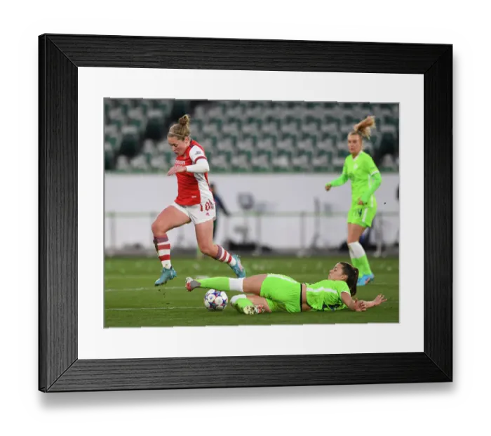 Framed Print : Arsenal vs. VfL Wolfsburg: A Battle in the UEFA Women's Champions League Quarterfinals