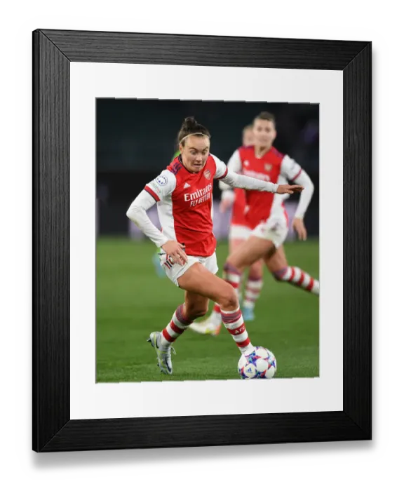 Framed Print : Arsenal's Caitlin Foord Fights for Victory in Champions League Quarterfinal Clash against VfL Wolfsburg