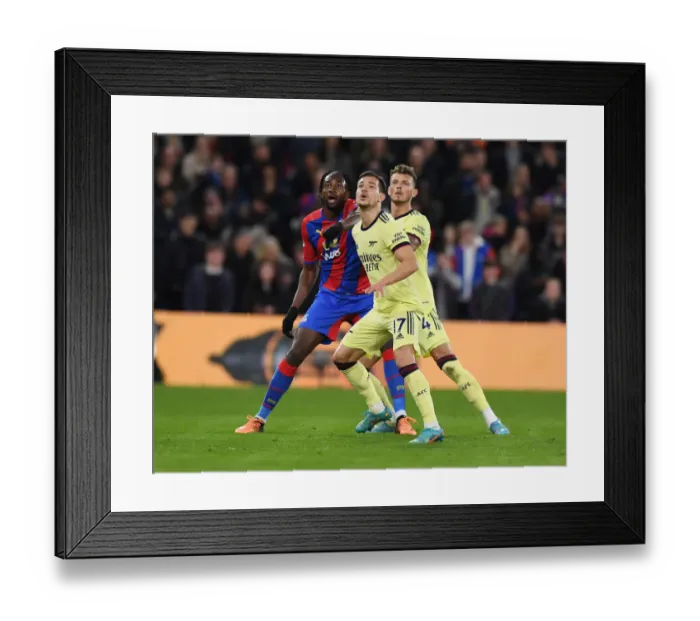 Framed Print : Arsenal Defenders Cedric and Ben White Fend Off Crystal Palace's Mateta in Intense Premier League Clash