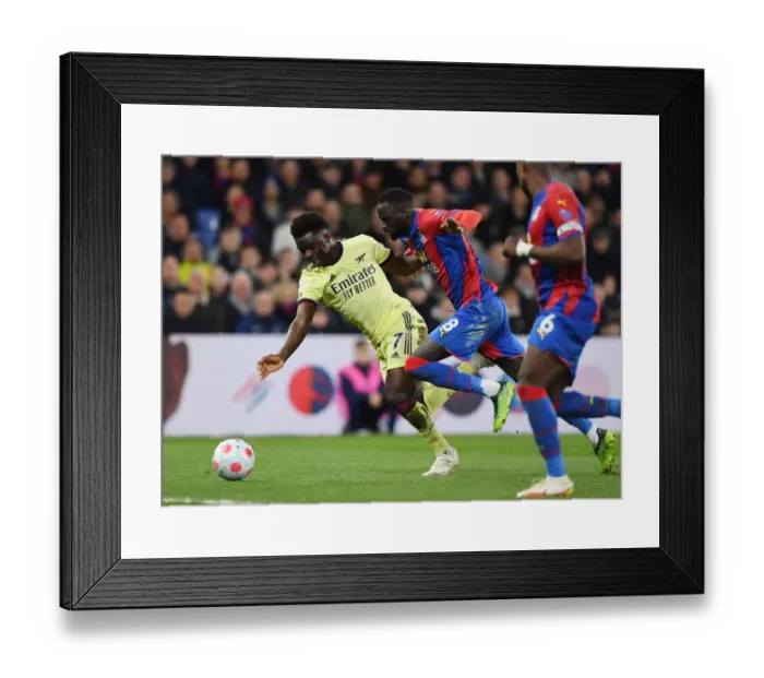 Framed Print : Saka vs. Kouyate: Intense Clash at Selhurst Park, Premier League 2021-22