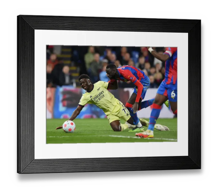 Framed Print : Saka vs. Kouyate: A Premier League Showdown at Selhurst Park