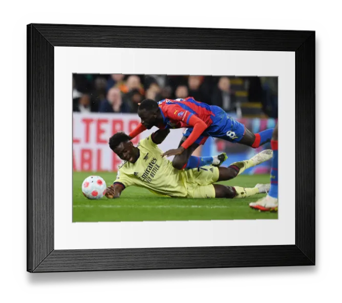 Framed Print : Saka vs. Kouyate: A Battle for Supremacy at Selhurst Park Framed Print : Saka vs. Kouyate: A Battle for Supremacy at Selhurst Park