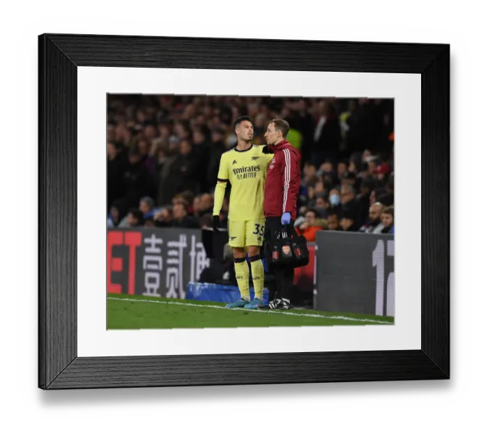 Framed Print : Arsenal's Ricky O'Donoghue Attends to Injured Gabriel Martinelli during Crystal Palace vs Arsenal (2021-22) Framed Print : Arsenal's Ricky O'Donoghue Attends to Injured Gabriel Martinelli during Crystal Palace vs Arsenal (2021-22)